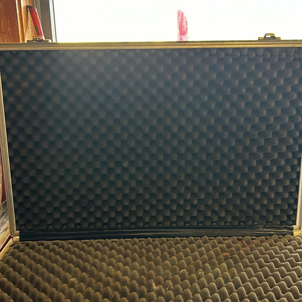 Aluminum padded case, handy for carrying anything; 24”long, 13.5”wide 4” deep